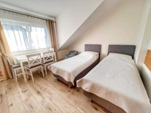 Postel nebo postele na pokoji v ubytování Niedaleko Morza