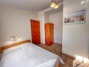 Postel nebo postele na pokoji v ubytování Niedaleko Morza