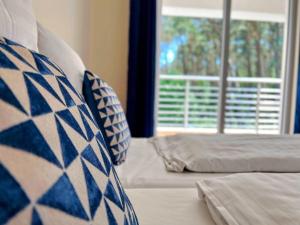 Letto o letti in una camera di Polana Łukęcin - Pobierowo