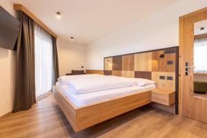 Postel nebo postele na pokoji v ubytování Hotel Piccolo