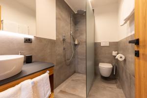 Koupelna v ubytování Hotel Piccolo