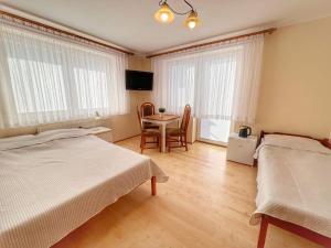 Postel nebo postele na pokoji v ubytování Niedaleko Morza