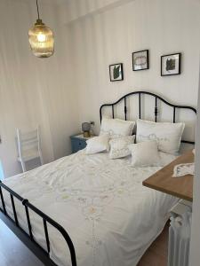 מיטה או מיטות בחדר ב-Belappart
