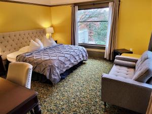 a hotel room with a bed and a window at Evermore Guesthouse in Portland