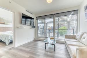 a living room with a couch and a table at Kensington Suite 2bed & 1bath in Calgary