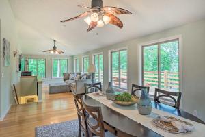 a dining room and living room with a ceiling fan at Pickwick Lake Home with Screened-In Porch, Dock in Counce