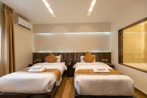 Katil atau katil-katil dalam bilik di Nansc Hotel