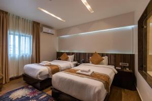 Katil atau katil-katil dalam bilik di Nansc Hotel