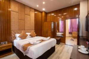 Katil atau katil-katil dalam bilik di Nansc Hotel