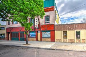 a building with a tree in front of it at Charming Choteau Apartment Central Location! in Choteau