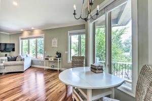 a living room with a table and chairs at Walk to Lake: Middlefield Home w/ Fire Pit in Middlefield