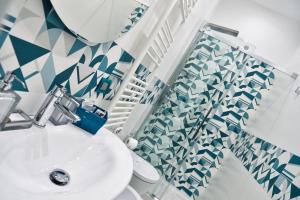a bathroom with a sink and a shower at Serenis Luxury Apartments in Minori +41 photos