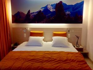 Ліжко або ліжка в номері Hotel Tamaro