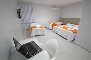 Postel nebo postele na pokoji v ubytování Hotel Encantos de Penedo Alagoas