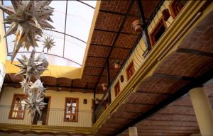 a building with chandeliers hanging from the ceiling at OYO Hotel Castillo Santa Cecilia in Tapalpa