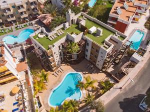an aerial view of a resort with a swimming pool at Alhambra Boutique Apartments by TAM Resorts in Playa del Ingles