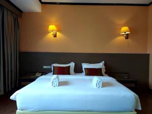 Postel nebo postele na pokoji v ubytování M Hotel Danok