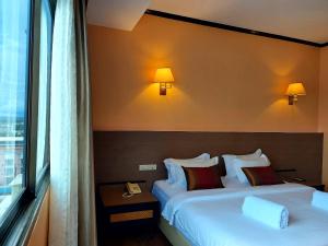 Postel nebo postele na pokoji v ubytování M Hotel Danok
