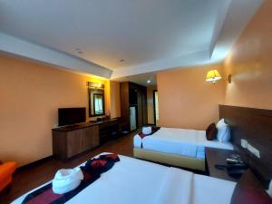 Postel nebo postele na pokoji v ubytování M Hotel Danok
