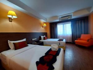 Postel nebo postele na pokoji v ubytování M Hotel Danok