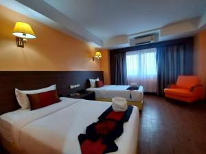 Postel nebo postele na pokoji v ubytování M Hotel Danok
