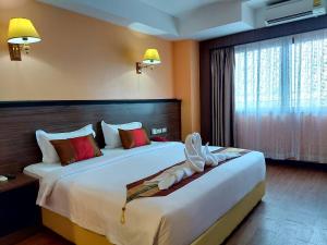 Postel nebo postele na pokoji v ubytování M Hotel Danok