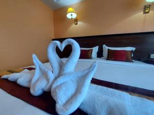 Postel nebo postele na pokoji v ubytování M Hotel Danok