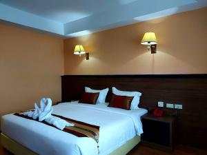 Postel nebo postele na pokoji v ubytování M Hotel Danok