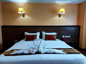 Postel nebo postele na pokoji v ubytování M Hotel Danok