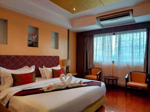 Postel nebo postele na pokoji v ubytování M Hotel Danok + 37 fotografií
