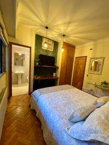 Postel nebo postele na pokoji v ubytování Bed & Breakfast Lastarria
