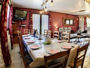 a dining room with a long table with chairs at Chalet Le Corbier, 6 pièces, 12 personnes - FR-1-267-174 in Le Corbier