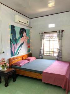 Vuode tai vuoteita majoituspaikassa HOMESTAY LOAN ANH