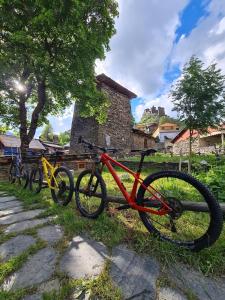 a group of bikes parked next to a fence at Guesthouse Tushetian Tower in Omalo