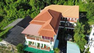 an overhead view of a house with an orange roof at Lanta Just Come Hotel in Ko Lanta