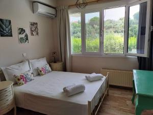 Postel nebo postele na pokoji v ubytování KLADIS HOME