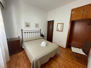 Postel nebo postele na pokoji v ubytování Arteaga Hostal & Baños Arabes Elvira