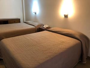 Postel nebo postele na pokoji v ubytování Hotel Lorena
