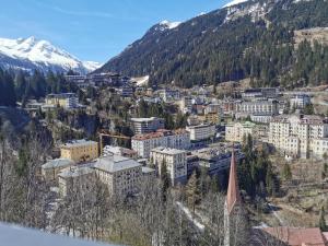 a view of a city with a mountain at The View - Design Panorama Lodge DAS SCHILLER in Bad Gastein