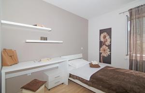 Postel nebo postele na pokoji v ubytování Apartment Moretić