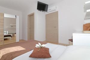 Postel nebo postele na pokoji v ubytování Apartment Moretić