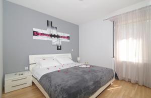 Postel nebo postele na pokoji v ubytování Apartment Moretić