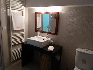 a bathroom with a sink and a toilet at Rodi House in Nafplio +49 photos