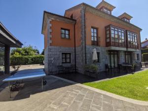 Imagen de la galería de Apartamentos Mazuga Rural, en Póo