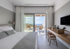 A bed or beds in a room at Ariadne Suites