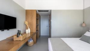 A bed or beds in a room at Ariadne Suites