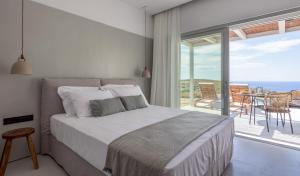 A bed or beds in a room at Ariadne Suites