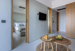 A bed or beds in a room at Ariadne Suites