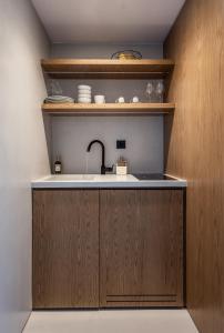A kitchen or kitchenette at Ariadne Suites