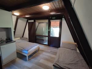 Posteľ alebo postele v izbe v ubytovaní Mátrai Vándor Apartmanok